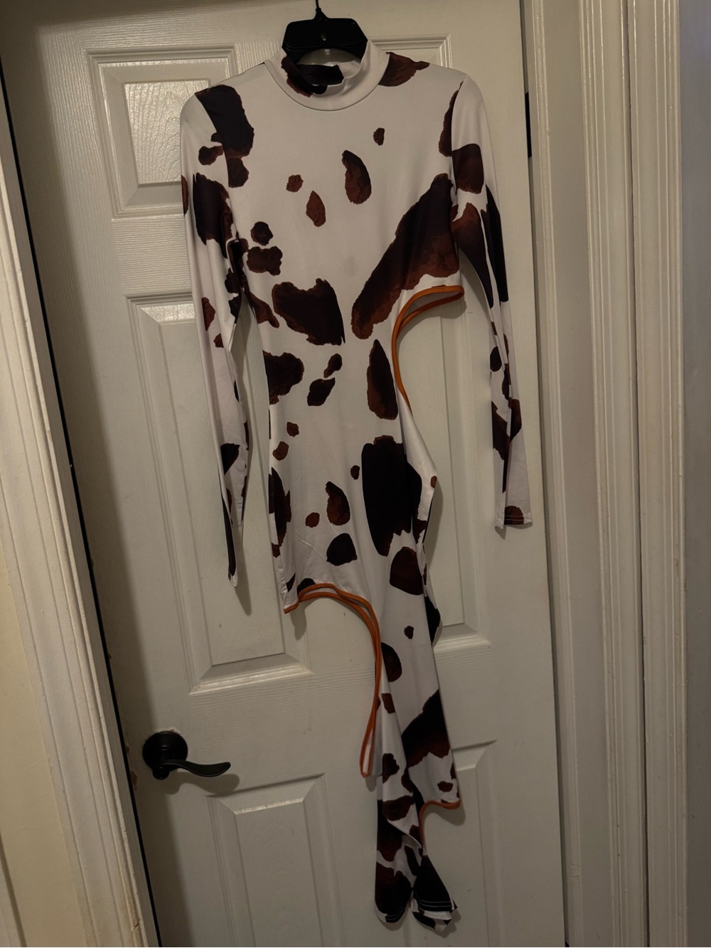 Cow print cutout dress with orange trim